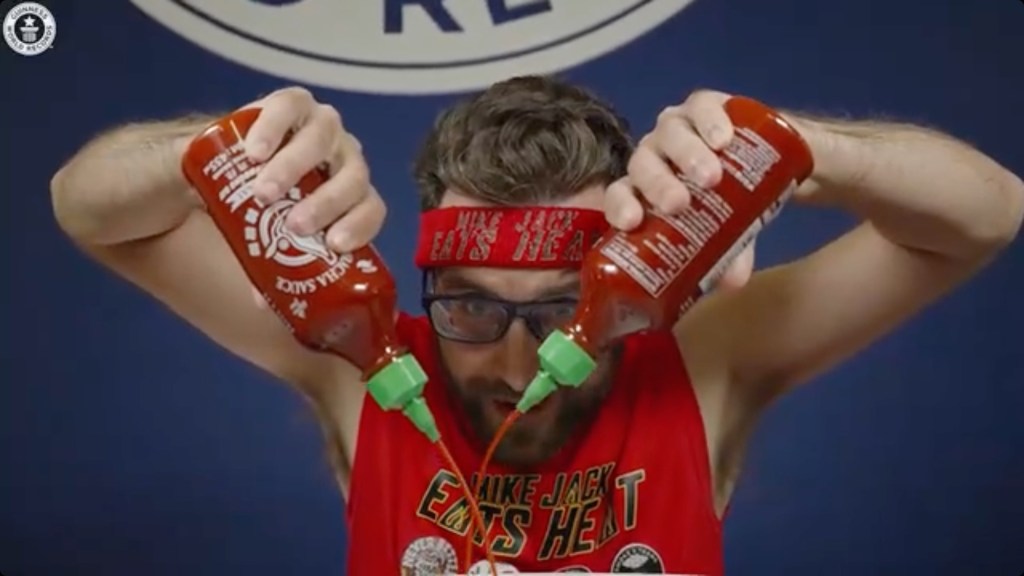 Spicy speed eater Mike Jack trying to break the record for the most hot sauce eaten in three minutes